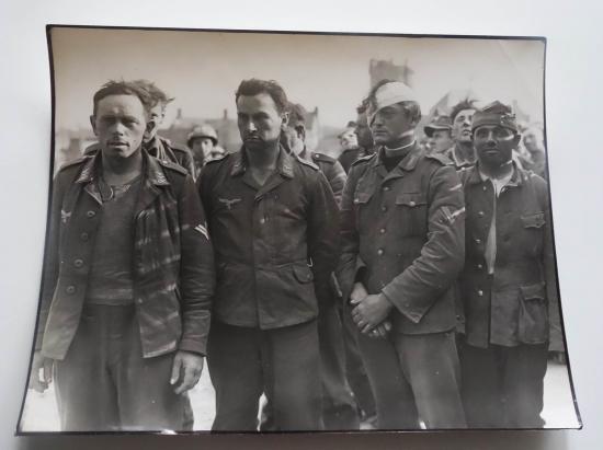 a british ww2 press picture of german prisoners of war