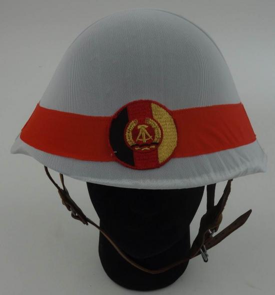 a postwar East German steel helmet.with cover