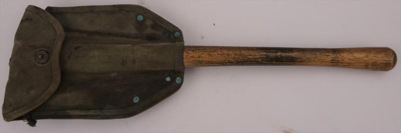 a US ww2 shovel with an original cover