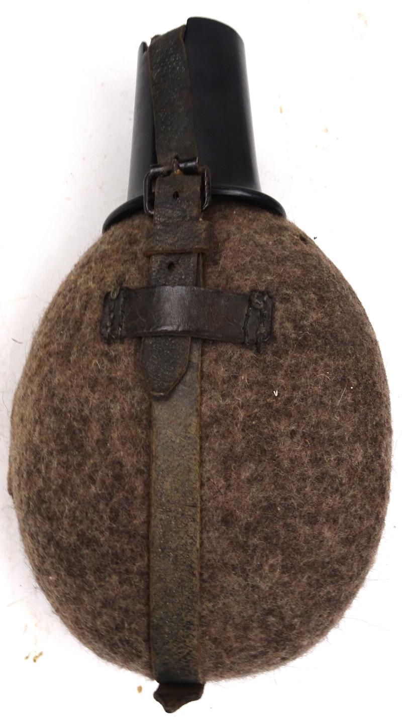 a german ww2 water bottle with cup