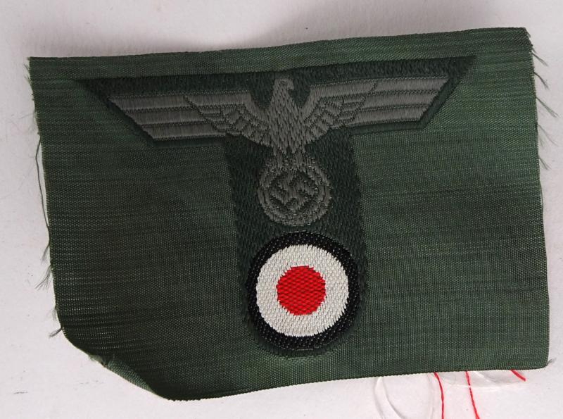 A wehrmacht m42 trapezoid bevo cap insignia