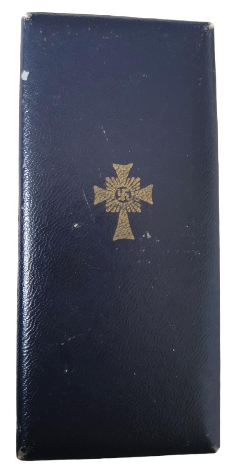 a german ww2 mother cross in gold in its original box