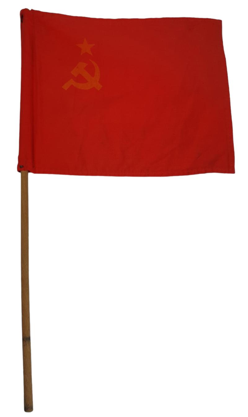 a russian ww2 flag on wooden stick