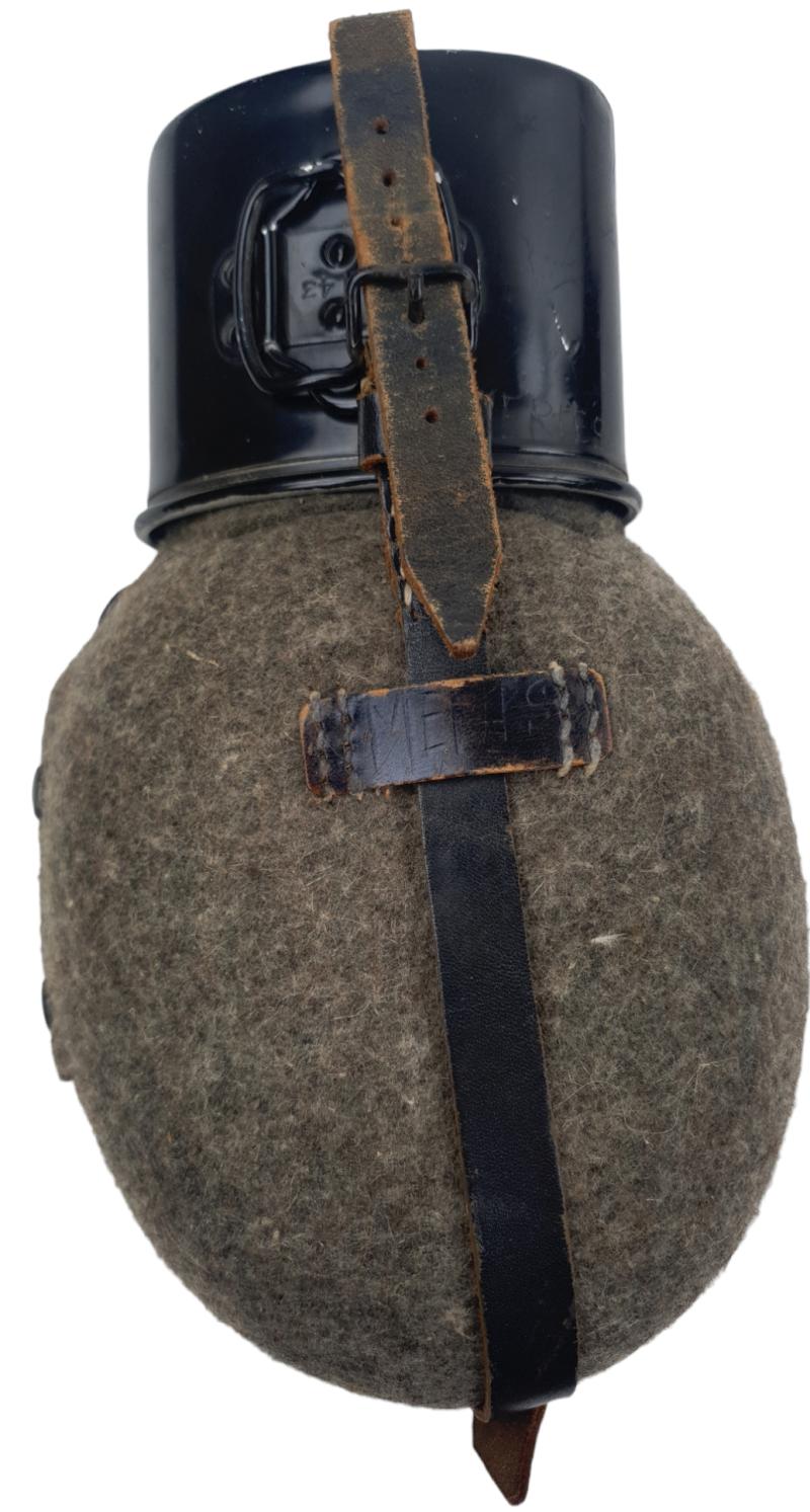 A Wehrmacht M31 Canteen with  steel  black cup