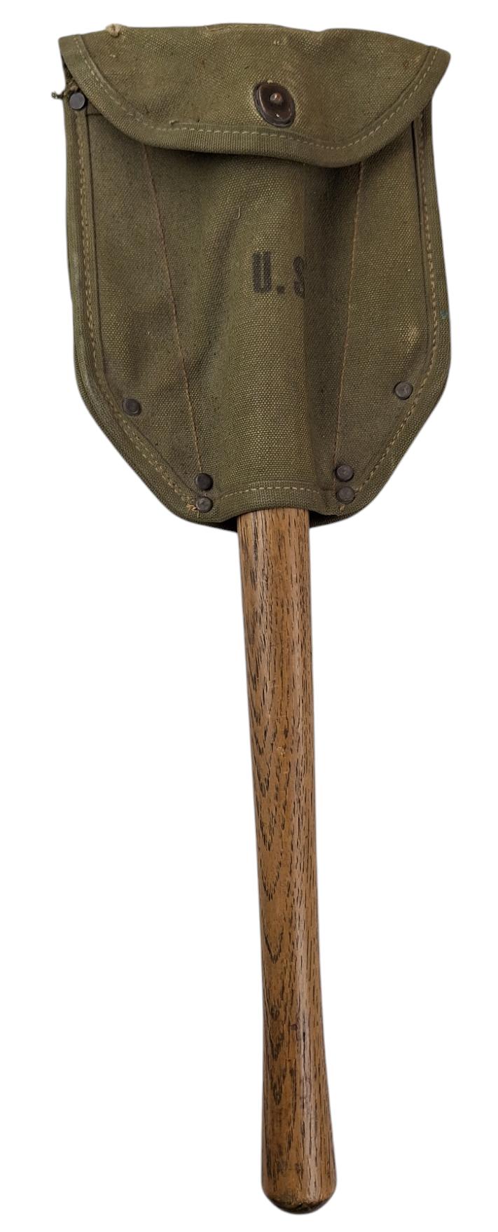 a US ww2 shovel with an original cover