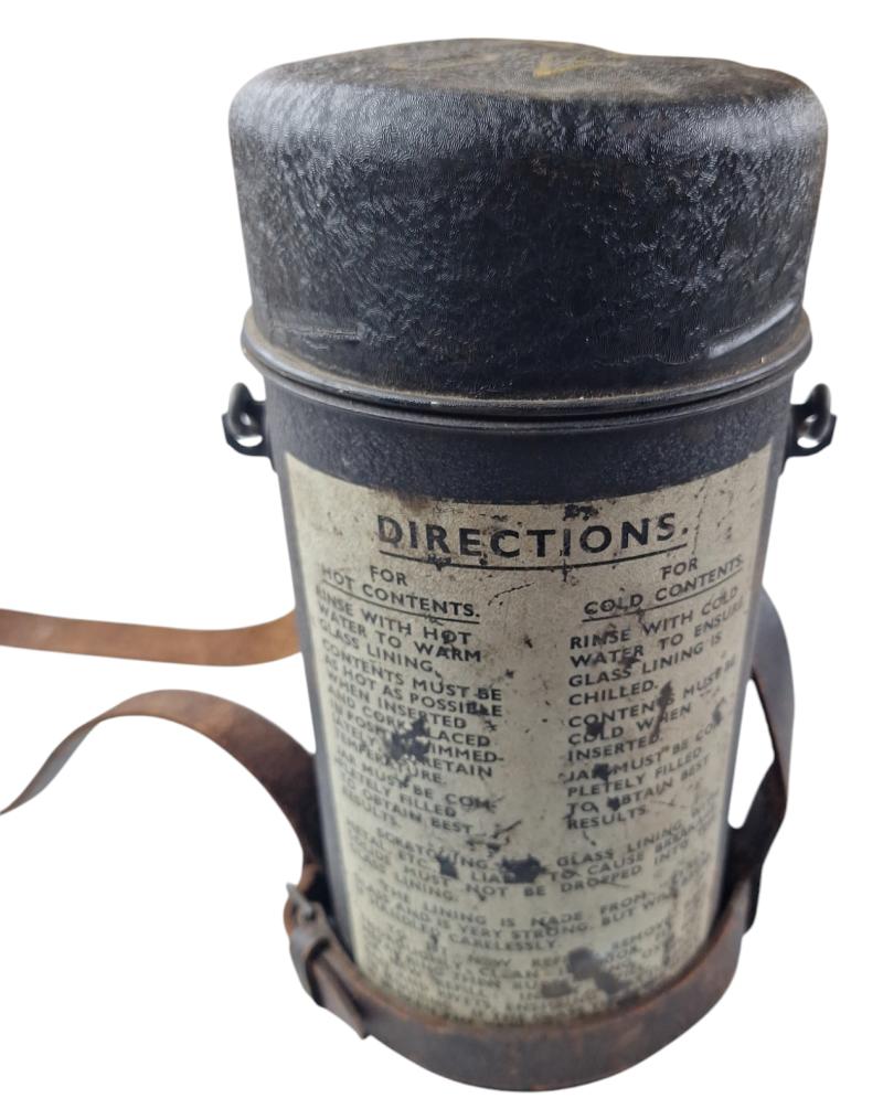 a british ww2 thermos can with date 44 with its original carrying strap