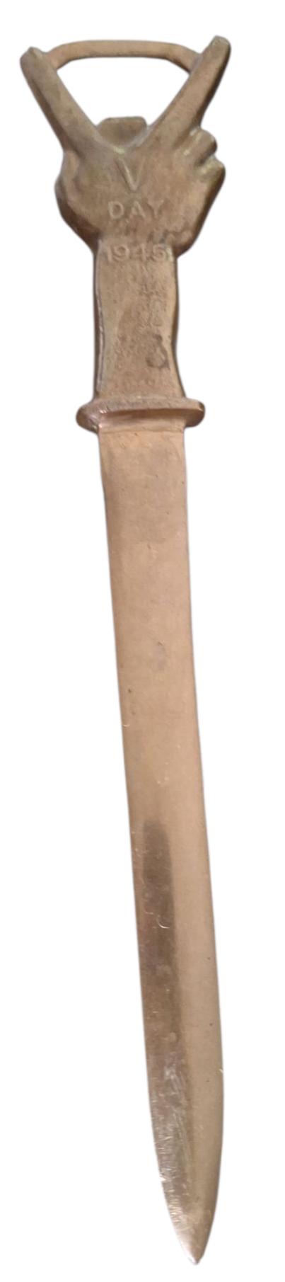 a british ww2 1945 letter opener with an image of winston churchill