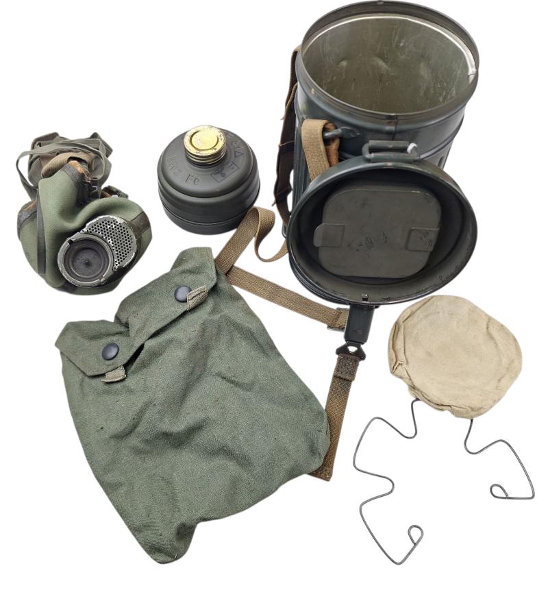 a  small   m38  gasmask with original carrying strap