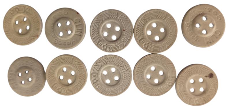10 buttons made from pressed paper